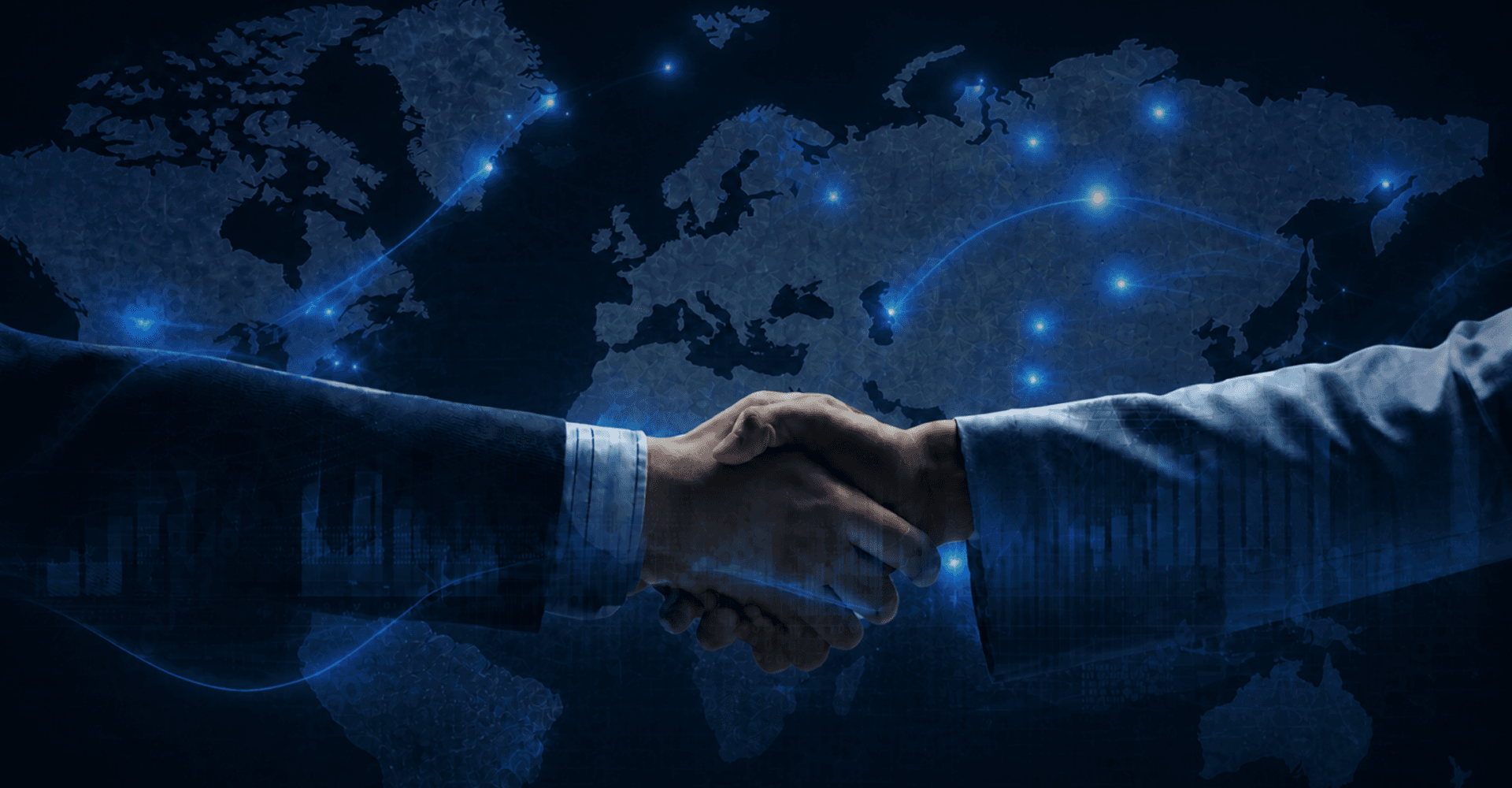 Business leaders shaking hands at a GETC partnership meeting